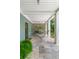 Relaxing covered patio with a hammock and stone floors perfect for outdoor living at 627 Barbados Dr, Charleston, SC 29492