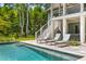 Beautiful pool area with lounge chairs, manicured landscaping, and access to the main house at 627 Barbados Dr, Charleston, SC 29492