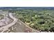 Expansive aerial view of home nestled among lush trees near the winding river at 7274 Commodore Rd, Hollywood, SC 29449