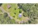 Aerial view of quaint home with spacious yard, surrounded by trees and adjacent properties at 7274 Commodore Rd, Hollywood, SC 29449