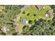 Aerial view of quaint home with spacious yard, surrounded by trees and adjacent properties at 7274 Commodore Rd, Hollywood, SC 29449