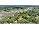 Gorgeous aerial view of home nestled among lush trees near the tidal rivers at 7274 Commodore Rd, Hollywood, SC 29449