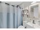 Cozy bathroom featuring a shower with a curtain, decorative shelves, and neutral decor at 7274 Commodore Rd, Hollywood, SC 29449