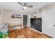 Bedroom featuring hardwood floors, a ceiling fan, workspace, and decorative elements at 7274 Commodore Rd, Hollywood, SC 29449