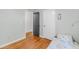 Neutral bedroom featuring hardwood flooring and two closets at 7274 Commodore Rd, Hollywood, SC 29449
