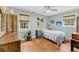 Bright bedroom with hardwood floors, natural light, ceiling fan, and charming decorations at 7274 Commodore Rd, Hollywood, SC 29449