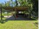 Covered carport area with gravel base, ideal for parking or outdoor storage at 7274 Commodore Rd, Hollywood, SC 29449