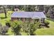 Charming brick home with well-maintained lawn, pretty shrubbery, and blue shutters at 7274 Commodore Rd, Hollywood, SC 29449