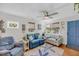 Comfortable living room with plush seating, a ceiling fan, and a starfish-themed rug on hardwood floors at 7274 Commodore Rd, Hollywood, SC 29449