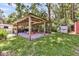 Outdoor pavilion with gravel flooring and ample space, perfect for gatherings at 7274 Commodore Rd, Hollywood, SC 29449