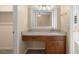 Bathroom vanity with granite countertop, undermount sink and decorative mirror at 8116 Long Shadow Ln, North Charleston, SC 29406