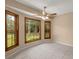 Bedroom with large windows offering an abundance of natural light and tile flooring at 8116 Long Shadow Ln, North Charleston, SC 29406