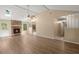 Spacious living room with hardwood floors, brick fireplace, vaulted ceilings, and natural light at 8116 Long Shadow Ln, North Charleston, SC 29406