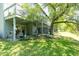 This backyard features a spiral staircase, lake view and greenery all around at 8483 Yadkin Cir # D, North Charleston, SC 29406