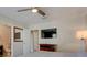 This inviting bedroom features modern ceiling fan, gray wood flooring, TV, and neutral colors at 8483 Yadkin Cir # D, North Charleston, SC 29406