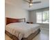 This cozy bedroom features modern ceiling fan, gray wood flooring, natural light, and neutral colors at 8483 Yadkin Cir # D, North Charleston, SC 29406