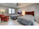 Comfortable bedroom with two twin beds, soft lighting, ceiling fan, and cozy seating area for relaxation at 8483 Yadkin Cir # D, North Charleston, SC 29406