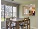Cozy dining area adjacent to kitchen, features natural light and counter seating at 8483 Yadkin Cir # D, North Charleston, SC 29406