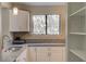 Kitchen features a large window, granite countertops, and stainless steel sink at 8483 Yadkin Cir # D, North Charleston, SC 29406
