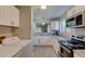 Bright eat-in kitchen features stainless appliances and washer/dryer at 8483 Yadkin Cir # D, North Charleston, SC 29406