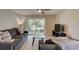 Living room featuring sliding glass doors opening to patio and lagoon at 8483 Yadkin Cir # D, North Charleston, SC 29406