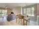 Open-concept living room dining room with slider to a rear patio at 8483 Yadkin Cir # D, North Charleston, SC 29406