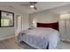Serene main bedroom with ceiling fan, soft lighting, and ample natural light, offering relaxation at 8483 Yadkin Cir # D, North Charleston, SC 29406
