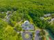 Aerial shot of community amenities including pool, clubhouse, parking, and tennis courts amid green space at 9175 Spring Branch Ct, North Charleston, SC 29406