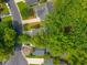 Aerial view featuring a neighborhood with tree-lined streets and well-maintained houses at 9175 Spring Branch Ct, North Charleston, SC 29406