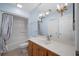 Bathroom with a shower-tub combination, vanity, and chandelier lighting at 9175 Spring Branch Ct, North Charleston, SC 29406