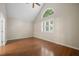 This bright room has hardwood floors, vaulted ceilings, and a window at 9175 Spring Branch Ct, North Charleston, SC 29406