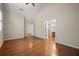 Spacious bedroom with high ceilings, hardwood floors, and an adjacent bathroom at 9175 Spring Branch Ct, North Charleston, SC 29406