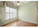 This room features hardwood floors, shuttered windows, and a ceiling fan at 9175 Spring Branch Ct, North Charleston, SC 29406