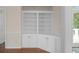 Built-in cabinets next to an entrance to a sunroom at 9175 Spring Branch Ct, North Charleston, SC 29406