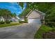 Charming house with a driveway, well-manicured lawn, and a beautiful tree at 9175 Spring Branch Ct, North Charleston, SC 29406