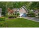 Charming single Gathering home with a well-manicured front lawn, driveway, and attached garage at 9175 Spring Branch Ct, North Charleston, SC 29406