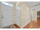 Inviting foyer featuring hardwood floors, a neutral color palette, and a view into other rooms at 9175 Spring Branch Ct, North Charleston, SC 29406