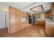 Kitchenette with an abundance of wooden cabinets, quartz counters and modern appliances at 9175 Spring Branch Ct, North Charleston, SC 29406