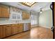 Bright kitchenette with light wood cabinets, a stainless steel dishwasher, and a skylight above at 9175 Spring Branch Ct, North Charleston, SC 29406