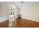 Bright living room features hardwood floors and a fireplace at 9175 Spring Branch Ct, North Charleston, SC 29406