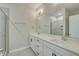 Modern bathroom showcasing a double vanity with quartz countertop, a large mirror and sleek fixtures at 0 Peirce Rd, Ridgeville, SC 29472