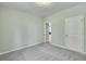 A cozy bedroom featuring neutral walls, plush carpeting, and a convenient doorway and closet at 0 Peirce Rd, Ridgeville, SC 29472