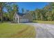 Spacious detached garage with ample parking space and a long driveway at 0 Peirce Rd, Ridgeville, SC 29472