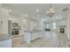 Open-concept kitchen and living room space with an island, stainless appliances and fireplace at 0 Peirce Rd, Ridgeville, SC 29472