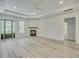 Spacious living room with a fireplace, ample natural light, and modern flooring at 0 Peirce Rd, Ridgeville, SC 29472