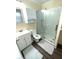 Spacious bathroom with shower, vanity, and storage at 1001 Palmetto Blvd, Edisto Island, SC 29438