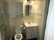 Clean, well-maintained bathroom with a vanity, toilet, and glass-enclosed shower at 1001 Palmetto Blvd, Edisto Island, SC 29438