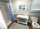 Small bathroom with a walk-in shower and vanity at 1001 Palmetto Blvd, Edisto Island, SC 29438