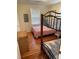 The bedroom features hardwood floors and a bunk bed, perfect for a guest room at 1001 Palmetto Blvd, Edisto Island, SC 29438