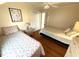 Cozy bedroom featuring twin beds, hardwood floors, and beachy decor at 1001 Palmetto Blvd, Edisto Island, SC 29438
